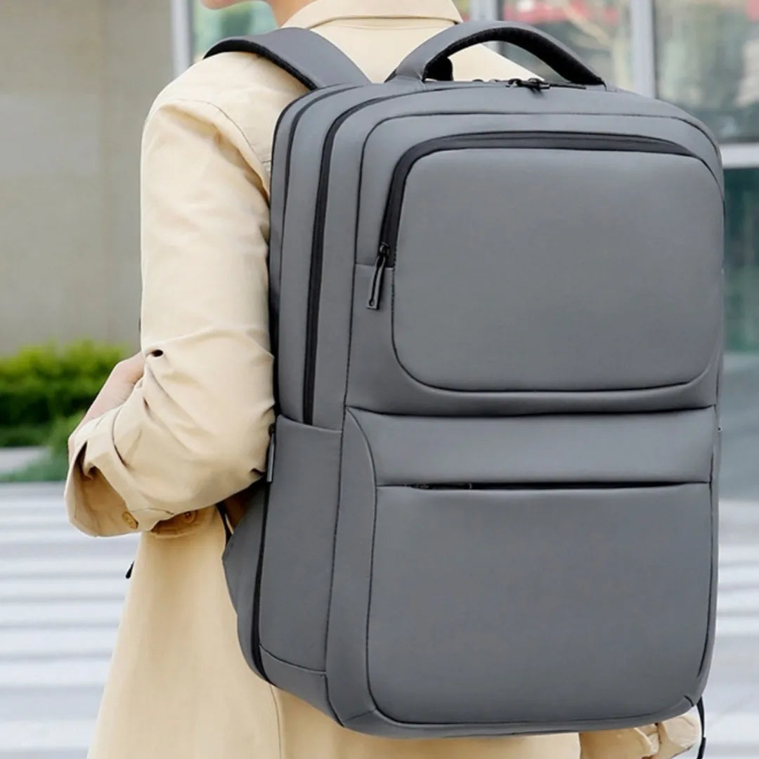 Unisex PU leather business backpack with air-cushion straps — 20–35L capacity