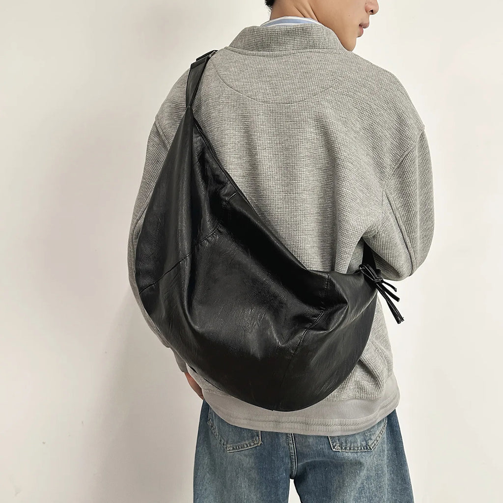Curved hobo crossbody bag in PU leather – adjustable strap for commuting or riding