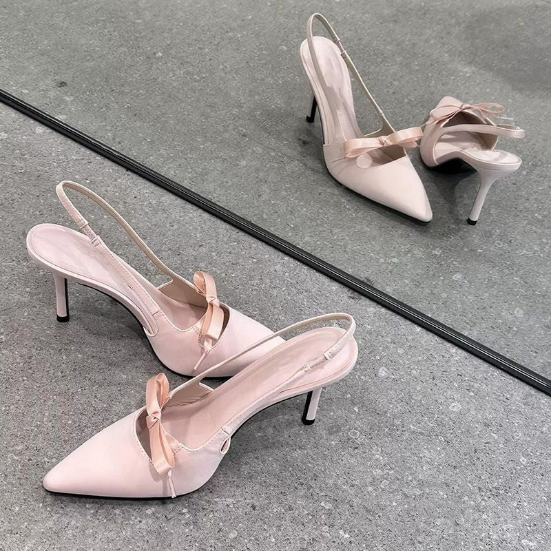 Women’s pointed-toe stiletto pumps with a bow and backless heel
