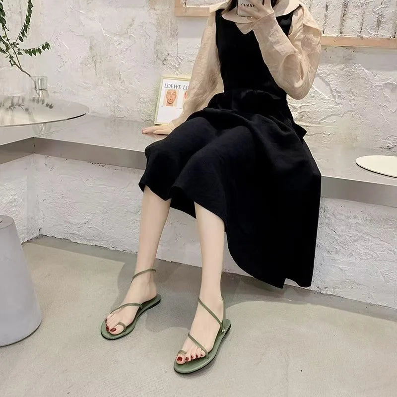 Women’s thin-strap flat sandals with an open toe for everyday summer wear