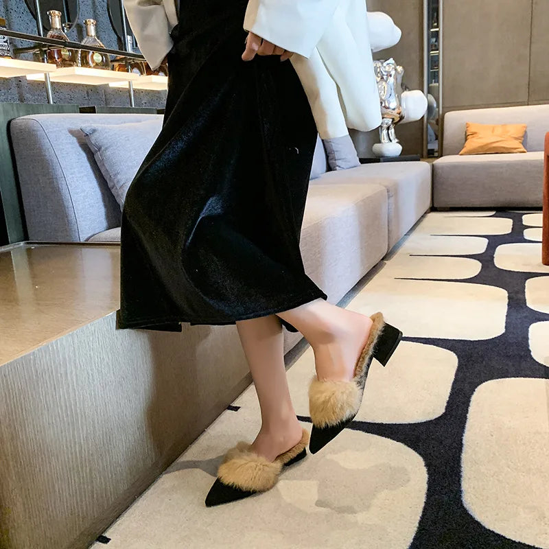 Pointed-toe suede mules with a faux-fur lining for cozy fall and winter wear