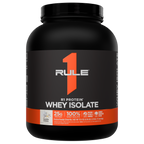 Black protein powder tub with an orange label The label reads R1 Protein Whey Isolate Vanilla Crème